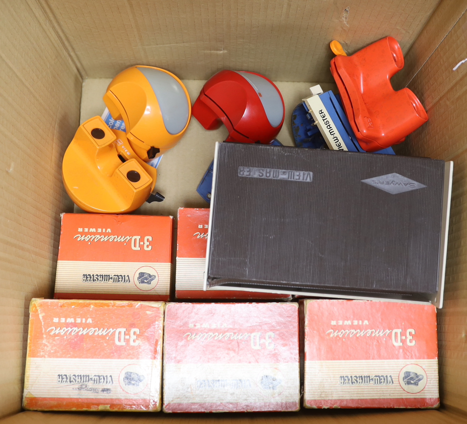 Fifteen View-Master viewers, including a large Mickey Mouse example, two ‘Model K’ viewers, one in red and another orange, together with a large quantity of reels with subjects including Natural History, National Parks,
